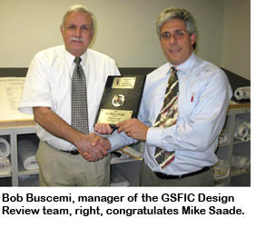 Photo of Mike Saade with award